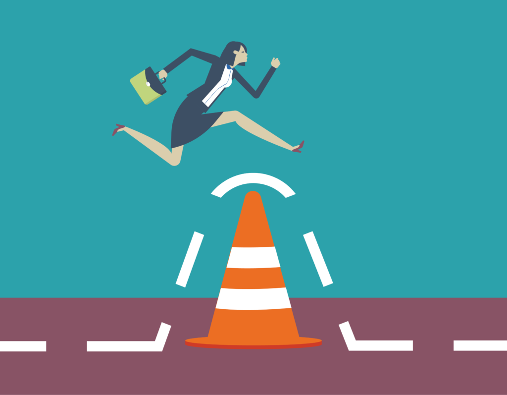skills gap - woman jumping over traffic cone with briefcase